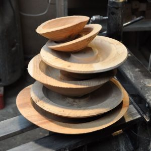 Part-turned wooden bowls ready for completion